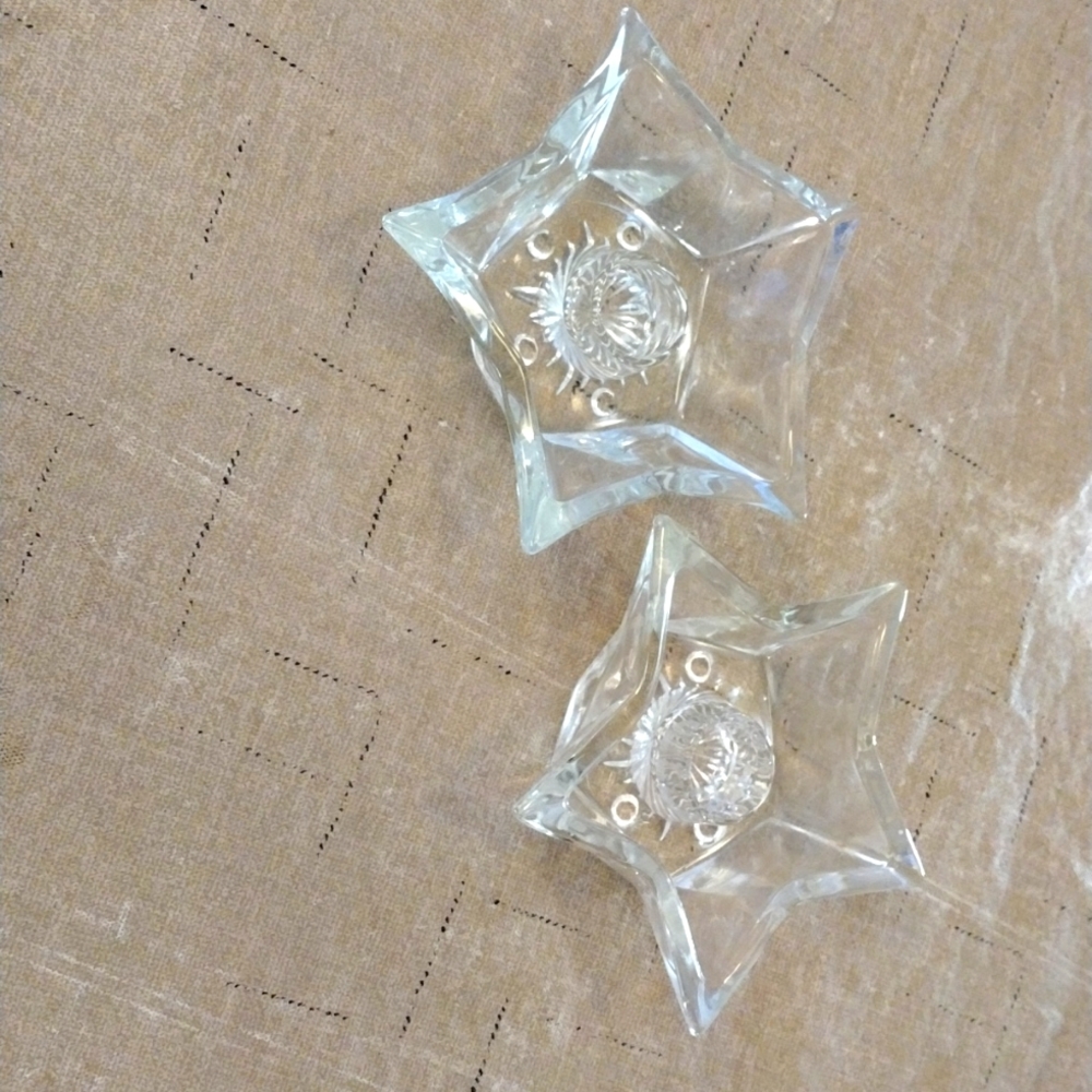 Two glass candleholders